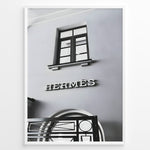Ladda upp bild till gallerivisning, Fashion Plakat | Hermès Storefront Minimalist Poster – Black &amp; White Fashion Wall Art Plakaty.dk | Black and white photo of the Hermès storefront with a clean minimalist facade, showing a window above the iconic logo and part of an ornate entryway gate.
