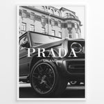 Ladda upp bild till gallerivisning, Fashion Plakat | Luxury Lifestyle: Mercedes G-Wagon x Prada Milano Wall Art Plakaty.dk | Black and white framed photo of a Mercedes G-Wagon with Prada Milano text overlay, parked in front of ornate historic buildings.
