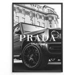 Ladda upp bild till gallerivisning, Fashion Plakat | Luxury Lifestyle: Mercedes G-Wagon x Prada Milano Wall Art Plakaty.dk | Black and white framed photo of a Mercedes G-Wagon with Prada Milano text overlay, parked in front of ornate historic buildings.
