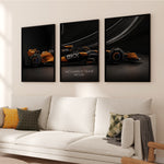 Ladda upp bild till gallerivisning, Triptych wall art plakat of the McLaren F1 Team MCL38 Formula 1 car displayed in a stylish living room with black leather furniture.
