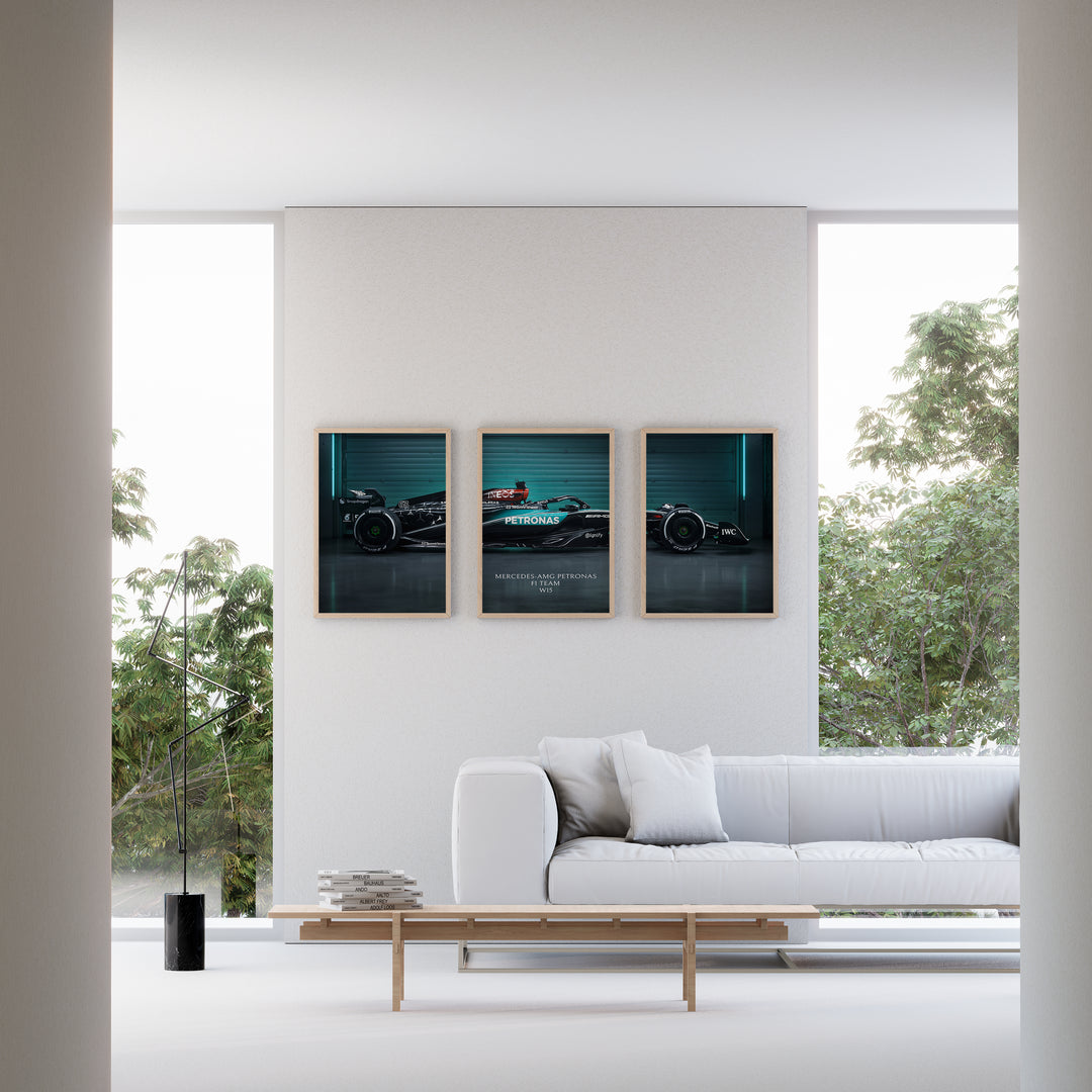 Triptych wall art plakat of the Mercedes-AMG Petronas F1 Team W15 Formula 1 car displayed in a modern living room with black leather furniture.