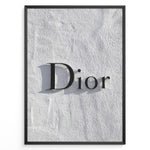 Ladda upp bild till gallerivisning, Fashion Plakat | Minimalist Dior Wall Sign – Timeless Fashion Statement Plakaty.dk | Minimalist black Dior logo mounted on a textured white wall, casting a soft shadow and evoking luxury and elegance.
