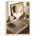 Ladda upp bild till gallerivisning, Fashion Plakat | Modern Vanity Scene with Sculptural Bust, Jewelry, and Perfume – Aesthetic Interior Print Plakaty.dk | Stylish vanity setup with a white classical bust, gold jewelry on a marble tray, designer perfumes, and crystal glassware in warm lighting.
