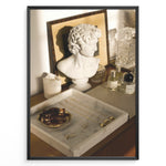 Ladda upp bild till gallerivisning, Fashion Plakat | Modern Vanity Scene with Sculptural Bust, Jewelry, and Perfume – Aesthetic Interior Print Plakaty.dk | Stylish vanity setup with a white classical bust, gold jewelry on a marble tray, designer perfumes, and crystal glassware in warm lighting.
