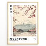 Ladda upp bild till gallerivisning, Japanske plakater | Vintage-style illustration of Mount Fuji with cherry blossoms falling over a peaceful lake and distant forest, featuring the text “Tokyo 1988.”
