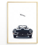 Ladda upp bild till gallerivisning, Framed minimalist poster of a black Jaguar E-Type classic sports car front view with the Jaguar leaping logo above on a white background.
