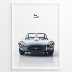 Ladda upp bild till gallerivisning, Framed minimalist poster of a silver Jaguar E-Type convertible classic car front view with Jaguar logo above on a white background.
