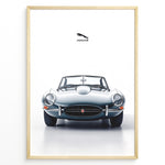 Ladda upp bild till gallerivisning, Framed minimalist poster of a silver Jaguar E-Type convertible classic car front view with Jaguar logo above on a white background.
