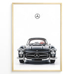 Ladda upp bild till gallerivisning, Framed minimalist poster of a black Mercedes-Benz 300SL classic convertible car front view with Mercedes logo above on a white background.
