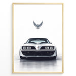 Ladda upp bild till gallerivisning, Illustration of a classic white Pontiac Trans Am viewed from the front with a bird emblem above.
