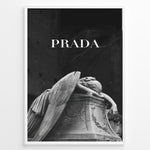 Ladda upp bild till gallerivisning, Fashion Plakat | Prada-Inspired Angel Statue – Fashion and Art Black and White Poster Plakaty.dk | Black and white artwork of a mourning angel statue with the word &quot;PRADA&quot; above, blending classical art and modern fashion
