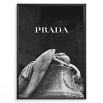 Ladda upp bild till gallerivisning, Fashion Plakat | Prada-Inspired Angel Statue – Fashion and Art Black and White Poster Plakaty.dk | Black and white artwork of a mourning angel statue with the word &quot;PRADA&quot; above, blending classical art and modern fashion
