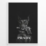 Ladda upp bild till gallerivisning, Fashion Plakat | Prada-Inspired Art Featuring Fierce Dog with Gun Plakaty.dk | Black Doberman with a studded collar holding a handgun in its mouth, set against a dark background with the word &quot;PRADA&quot; in bold white text.
