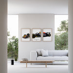 Ladda upp bild till gallerivisning, Triptych wall art plakat of the Red Bull Racing RB20 Formula 1 car displayed in a contemporary living room with a black leather sofa and modern furnishings.
