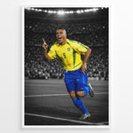 Ladda upp bild till gallerivisning, Ronaldo Nazário wearing the iconic yellow Brazil football jersey with number 9 while celebrating on the pitch. The black and white stadium background highlights the Brazilian colors.
