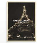 Ladda upp bild till gallerivisning, Fashion Plakat | Saint Laurent Eiffel Tower Night View – Paris Fashion Wall Art Plakaty.dk | Illuminated Eiffel Tower at night with &quot;Saint Laurent Paris&quot; logo centered in white text.
