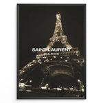 Ladda upp bild till gallerivisning, Fashion Plakat | Saint Laurent Eiffel Tower Night View – Paris Fashion Wall Art Plakaty.dk | Illuminated Eiffel Tower at night with &quot;Saint Laurent Paris&quot; logo centered in white text.

