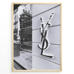 Ladda upp bild till gallerivisning, Fashion Plakat | Saint Laurent Paris Storefront – Monochrome Fashion Photography Plakaty.dk | Black and white image of a Saint Laurent Paris storefront featuring the reflective YSL logo on a textured exterior wall with modern architectural details.

