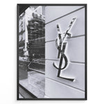 Ladda upp bild till gallerivisning, Fashion Plakat | Saint Laurent Paris Storefront – Monochrome Fashion Photography Plakaty.dk | Black and white image of a Saint Laurent Paris storefront featuring the reflective YSL logo on a textured exterior wall with modern architectural details.

