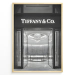 Ladda upp bild till gallerivisning, Fashion Plakat | Tiffany &amp; Co. Entrance – Luxury Jewelry Store Poster in Black &amp; White Plakaty.dk | Black and white photo of the Tiffany &amp; Co. boutique entrance with glass doors, a chandelier inside, and the illuminated brand name above.
