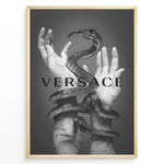 Ladda upp bild till gallerivisning, Fashion Plakat | Versace-Inspired Art Featuring Serpent and Marble Hands Plakaty.dk | Black-and-white image of a snake wrapped around two upward-reaching marble-textured hands, with the word &quot;VERSACE&quot; overlaid in bold, semi-blurred text.
