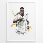 Ladda upp bild till gallerivisning, Framed watercolor-style plakat of Vinícius Jr. celebrating in a Real Madrid jersey with a gold artistic background
