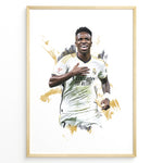 Ladda upp bild till gallerivisning, Framed watercolor-style plakat of Vinícius Jr. celebrating in a Real Madrid jersey with a gold artistic background
