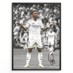 Ladda upp bild till gallerivisning, Framed Plakat of Vinícius Jr. in a Real Madrid kit doing a shrug celebration, with a black and white background and visible signature
