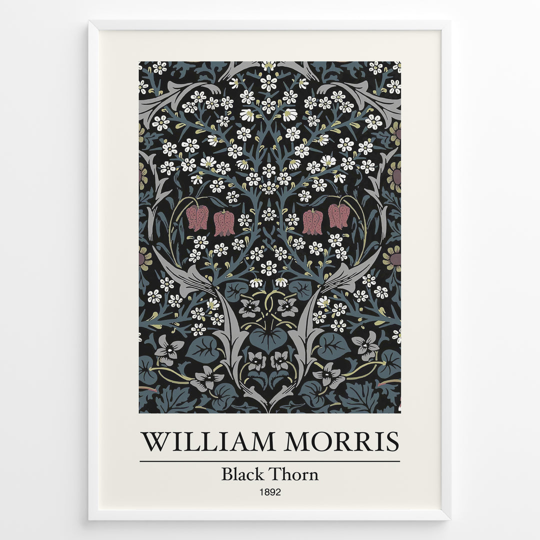 Framed William Morris Black Thorn 1892 art print plakat with detailed white and red flowers and blue-green leaves on a black background.