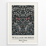 Ladda upp bild till gallerivisning, Framed William Morris Black Thorn 1892 art print plakat with detailed white and red flowers and blue-green leaves on a black background.
