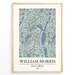 Ladda upp bild till gallerivisning, William Morris Sweet Briar 1887 botanical floral pattern art print with blue and beige leaves and flowers in black frame plakat.
