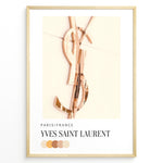 Ladda upp bild till gallerivisning, Fashion Plakat | Yves Saint Laurent Paris – Rose Gold Emblem Poster Plakaty.dk | Rose gold Yves Saint Laurent logo on a soft beige background with a neutral color palette and Paris/France label beneath.

