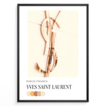 Ladda upp bild till gallerivisning, Fashion Plakat | Yves Saint Laurent Paris – Rose Gold Emblem Poster Plakaty.dk | Rose gold Yves Saint Laurent logo on a soft beige background with a neutral color palette and Paris/France label beneath.
