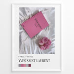 Ladda upp bild till gallerivisning, Fashion Plakat | Yves Saint Laurent Pink Book on Silk – Paris Fashion Decor Plakaty.dk | Yves Saint Laurent pink Catwalk book placed on white silk fabric with pink roses beside it, representing Parisian luxury and soft elegance.
